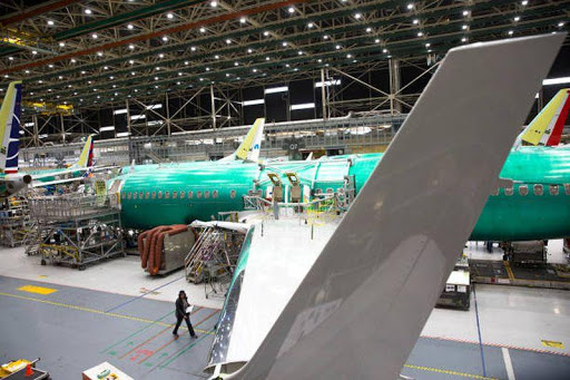 Employees work on Boeing 737
